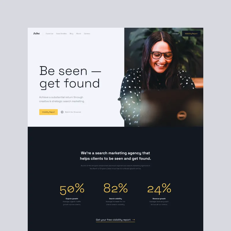 Search marketing agency homepage with a smiling woman working on a laptop.